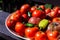 Summertime bumper crop of tomatoes and other vegetables on a tray.