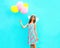 Summertime! Fashion cute smiling woman with an air colorful balloons