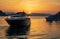 Summertime luxury yacht at sunset as seen from the beach of Aponissos, Agistri island, Saronic gulf, Greece