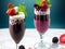 Summertime Treat: Vibrant Delicious Smoothies Milkshakes For Hot Summer Vacations In Blue Background. Ai Generated