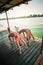 Summertime yoga couple of women doing yoga on river raft