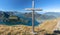 Summit cross on the Fronalpstock in the background of Lake Lucerne