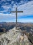 Summit cross on the Hochwart mountain in the Pizol area above the Wildsee and Batoni. Hiking in beautiful autumn.