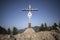 Summit cross of mountain Heuberg, Bavaria in springtime