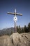 Summit cross of mountain Heuberg, Bavaria in springtime