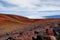 The summit of Mauna Kea, a dormant volcano on the island of Hawaii. Stunningly beautiful red stone peak hovering above clouds, the