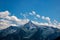 Summit of the mountain `Ahornberg` in zillertal/austria with rocks, green meadow