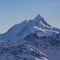 Summit of Weisshorn mountain in Switzerland in winter, blue sky