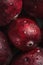 A sumptuous close-up of a cranberry glistens with water droplets