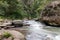 Sumpul river between El Salvador and Honduras, Central America. Forest and mountain rover landscape, Country border. Rocks and