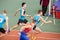 SUMY, UKRAINE - FEBRUARY 22, 2020: sportsmen handing over the baton in 4x400m relay at Ukrainian indoor track and field