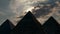 Sun appears over ancient pyramids