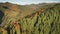 Sun autumn mountain trees at ranges. Aerial nobody nature landscape. Road at mount valley village