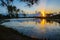 Sun Beams & Pine Cones Over the Lake at Sunrise