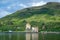 Sun beams at scottish highlands and Eilean Donan Castle