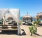 Sun beds on sandy beach coast, luxury Mediterranean resort as travel destination