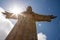 Sun behind Christus Rei Statue in Lisbon, Portugal