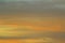 Sun below the horizon and clouds in the fiery dramatic orange sky at sunset or dawn backlit by the sun. Place for text and design