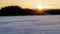 Sun Burst At Sunset Over A Frozen Canadian Lake