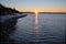 Sun bursts over North Cascades Mountains and Semiahmoo Bay