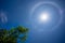 Sun with a circular rainbow,Fantastic beautiful sun halo phenomenon in Thailand