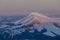 The sun-drenched peak of Mount Farcau, Repedea, Maramures County, Romania