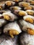 Sun dried freshwater fish with yellow eggs and cut-off head and ready to cook. Close up fish with selective focus