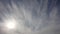 Sun and fibrous clouds