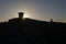 Sun flare from behind toposcope at worcestershire beacon at sunrise