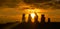 SUN FLARE: Golden sunset illuminates a row of moai statues on Easter Island.