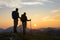 SUN FLARE: Unrecognizable man and girlfriend trekking in Alps watch the sunrise.