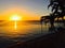 Sun going down in Key Biscayne Florida with palm trees in front