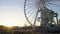 Sun going down in Paris, big wheel in Tuileries Garden, Eiffel Tower in distance