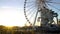 Sun going down in Paris, big wheel in Tuileries Garden, Eiffel Tower in distance
