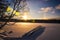 Sun halo above snowed lake