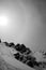 Sun halo in a snowy mountain in black and white