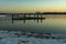 The sun has just set over this boat dock in a wintry lake Zoetermeerse Plas