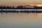 The sun has just set over an island with resting cormorants in lake Zoetermeerse Plas