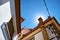 Sun hiding behind the chimney in the roof of a typical Andalusian house.