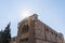 The sun illuminates the holy cross at a Christian monastery located on Derekh Shechem street - Nablus Road - in Jerusalem, Israel