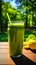 Sun-Kissed Sips: A Refreshing Green Smoothie in a Tranquil Fores