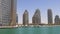 Sun light day time cayan tower dubai marina gulf bay 4k uae