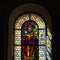 Sun light through the leaded pane in old majestic church