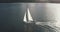 Sun light at sea bay with luxury yacht reflection aerial. Passenger sailboat cruise at open ocean
