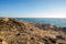 Sun light with shadow on Sea wave behind the rock and sand shore