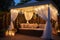 a sun lounger under a gazebo, surrounded by hanging fairy lights