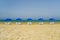 Sun loungers and a beach umbrella on a deserted beach