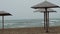 Sun loungers lined up by the sea. Static 4K shooting.