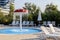 Sun loungers are located near the pool with a children's fountain-waterfall in the form of a mushroom muhamor