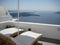 Sun loungers with a view of the Santorini Caldera